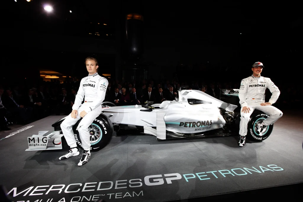 Nico Rosberg and Michael Schumacher at the Mercedes W01 launch