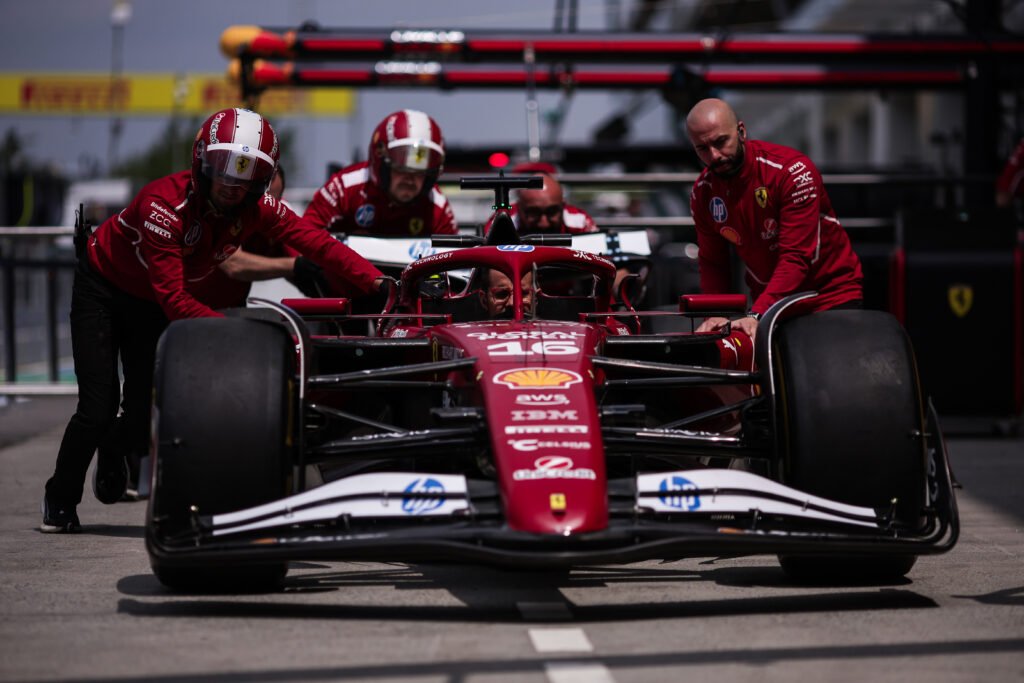 Charles Leclerc and Scuderia Ferrari team members at the 2025 F1 Canadian GP.