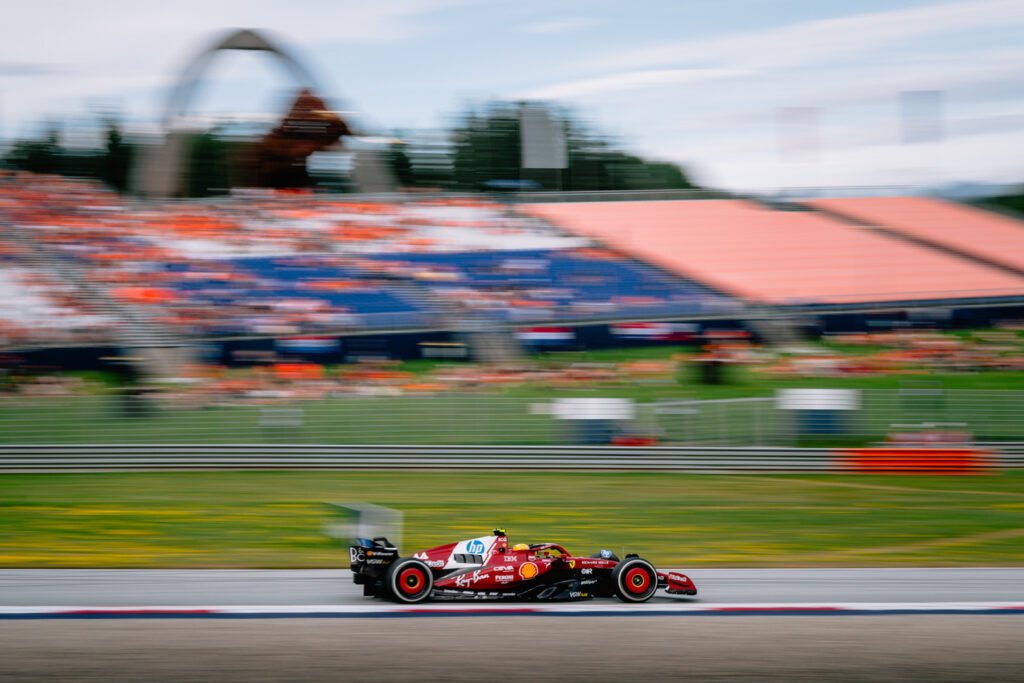Lewis Hamilton racing around track at the 2025 F1 Austrian Grand Prix.
