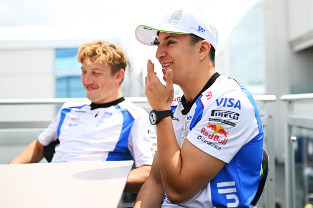 MONTREAL, QUEBEC - JUNE 12: Liam Lawson of New Zealand and Visa Cash App Racing Bulls and Isack Hadjar of France and Visa Cash App Racing Bulls talk in the Paddock during previews ahead of the F1 Grand Prix of Canada at Circuit Gilles-Villeneuve on June 12, 2025 in Montreal, Quebec
