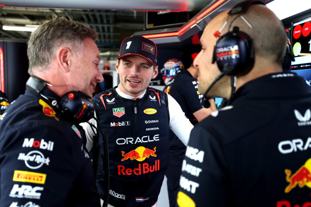 MONTREAL, QUEBEC - JUNE 15: Christian Horner, Team Principal of Oracle Red Bull Racing Max Verstappen of the Netherlands and Oracle Red Bull Racing and Gianpiero Lambiase, Head of Racing of Oracle Red Bull Racing talk in the garage prior to the F1 Canadian GP at Circuit Gilles-Villeneuve on June 15, 2025 in Montreal, Quebec.