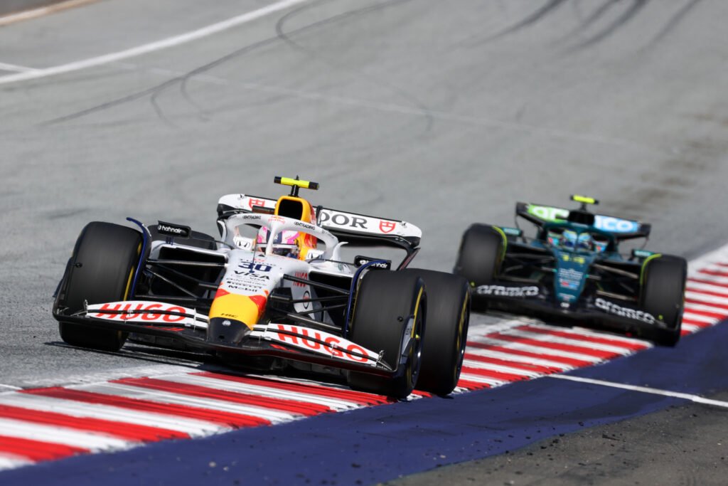 Liam Lawson heading into T1 at the 2025 F1 Austrian GP, ahead of Fernando Alonso.