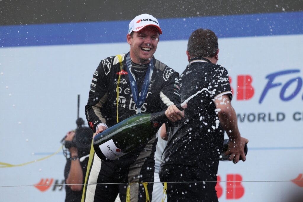 Race winner Nick Cassidy of New Zealand and Jaguar TCS Racing celebrates on the podium during the Berlin E-Prix, Round 14 of the 2025 FIA Formula E World Championship at Tempelhof Airport Circuit