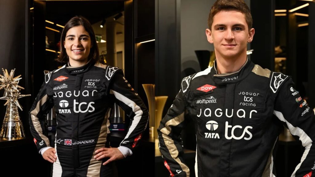 Jamie Chadwick and Leonardo Fornaroli posing in Jaguar Formula E race suits.