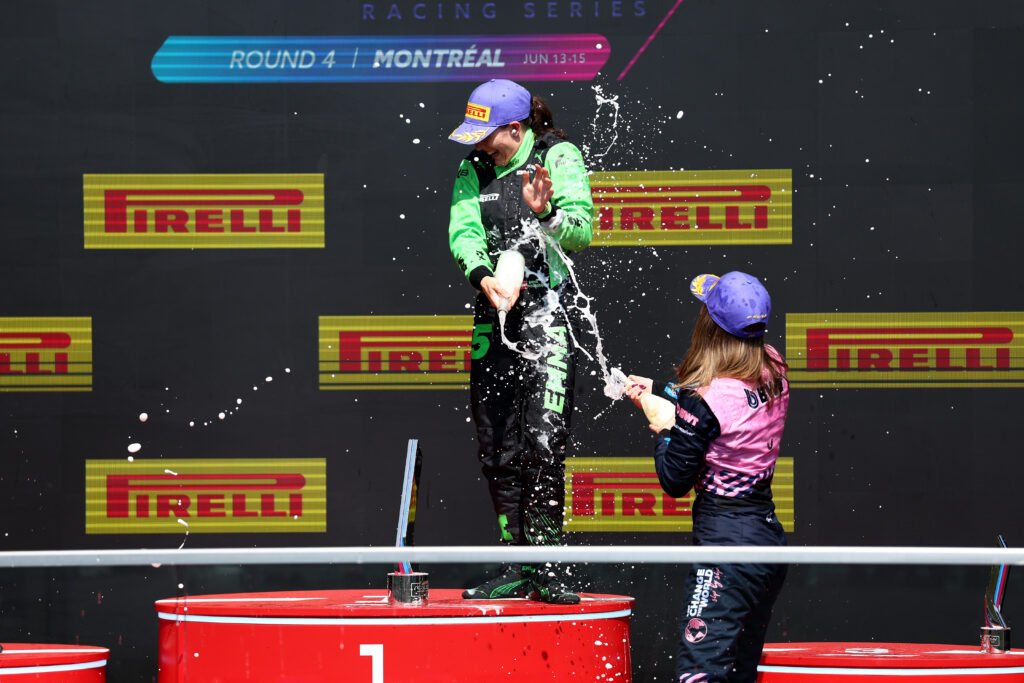 MONTREAL, QUEBEC - JUNE 14: Race winner Emma Felbermayr of Austria and Rodin Motorsport (5) and Third placed Nina Gademan of Netherlands and PREMA Racing (3) celebrate on the podium with Champagne during F1 Academy Round 4, race 2 at Circuit Gilles-Villeneuve on June 14, 2025 in Montreal, Quebec.