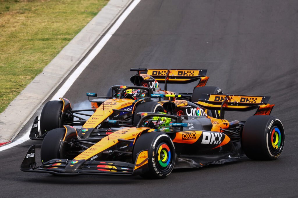 BUDAPEST, HUNGARY - AUGUST 03: Lando Norris of Great Britain driving the (4) McLaren MCL39 Mercedes and Oscar Piastri of Australia driving the (81) McLaren MCL39 Mercedes battle for track position during the F1 Hungarian GP at Hungaroring on August 03, 2025 in Budapest, Hungary. (Photo by Joe Portlock/Getty Images)