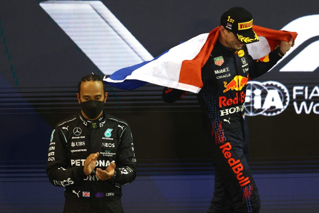 Max Verstappen and Lewis Hamilton podium at the F1 Abu Dhabi GP 2021