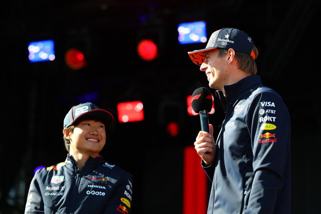 ZANDVOORT, NETHERLANDS - AUGUST 29: Yuki Tsunoda of Japan and Oracle Red Bull Racing and Max Verstappen of the Netherlands and Oracle Red Bull Racing talk to the crowd on the fan stage prior to practice ahead of the F1 Grand Prix of Netherlands at Circuit Zandvoort on August 29, 2025 in Zandvoort, Netherlands. (Photo by Mark Thompson/Getty Images) // Getty Images / Red Bull Content Pool // SI202508290160 // Usage for editorial use only //